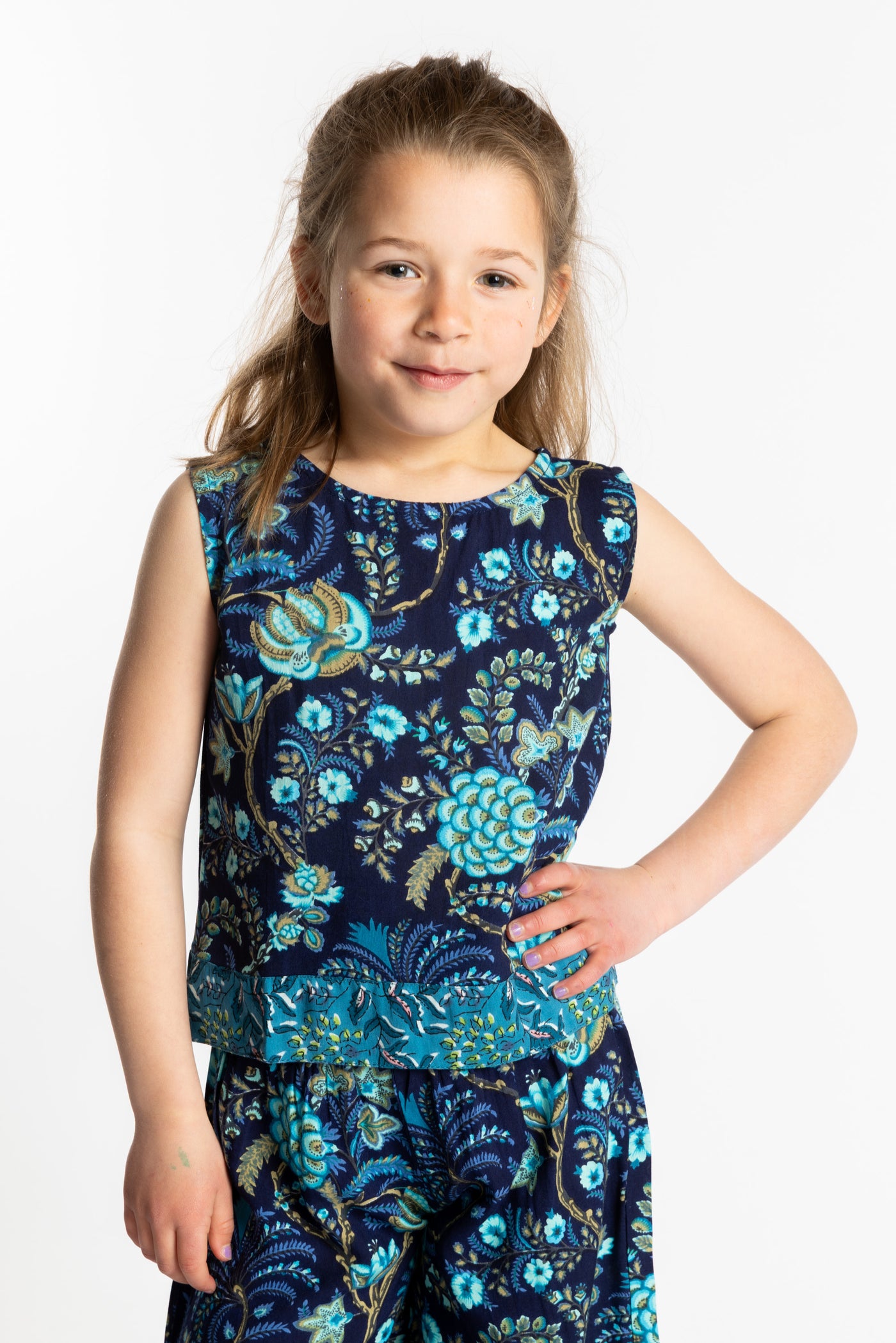 Louisa age 7 wearing size Small Sahana Contrast Hem Kids Top in navy floral print