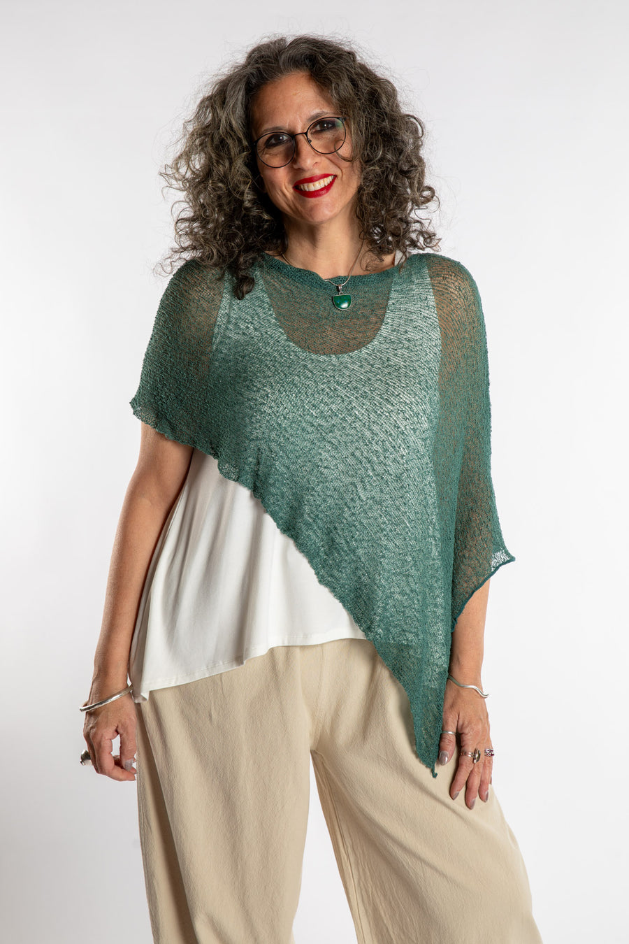 Susan is wear the Magic Lightweight Capelet in Teal