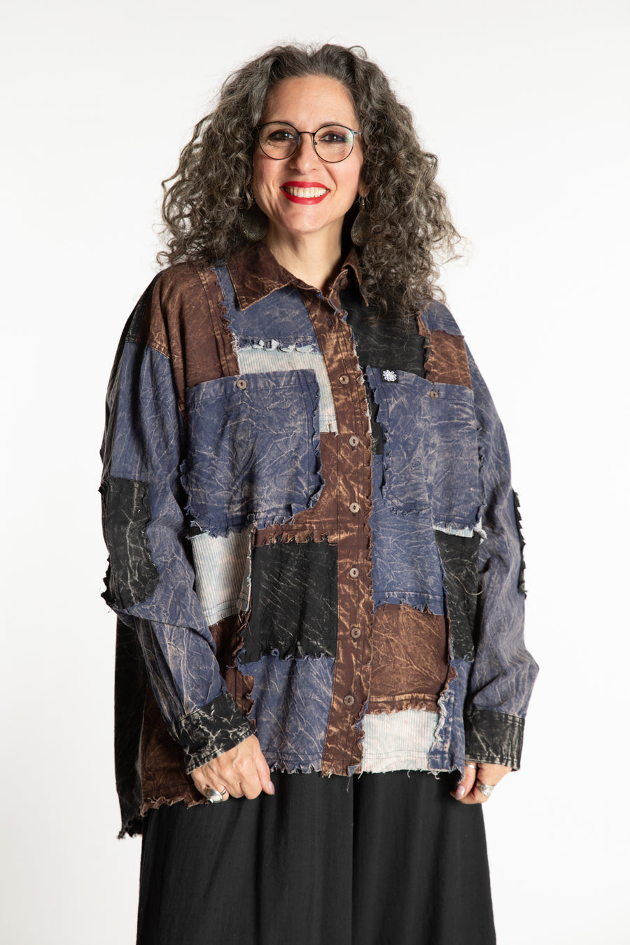 Susan is wearing the One Size Makalu Patchwork Overshirt in North Sea