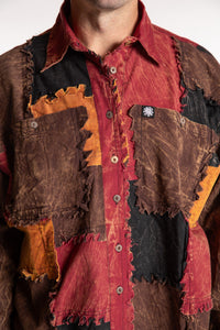 Topher is wearing the One Size Makalu Patchwork Overshirt in Spice Harvest