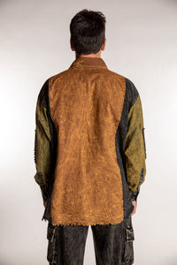 Topher is wearing the One Size Makalu Patchwork Overshirt in Timberline