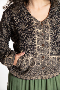 Susan is wearing the M/L Malini Soft Brushed Cardigan in Black