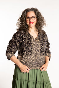 Susan is wearing the M/L Malini Soft Brushed Cardigan in Black