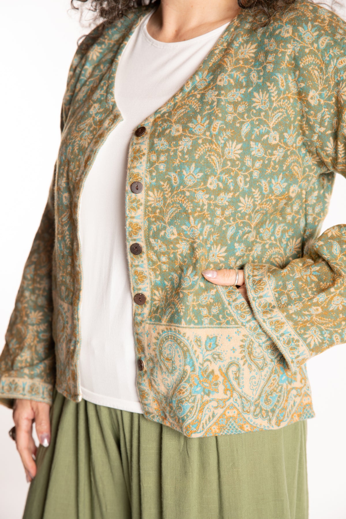 Susan is wearing the M/L Malini Soft Brushed Cardigan in Green