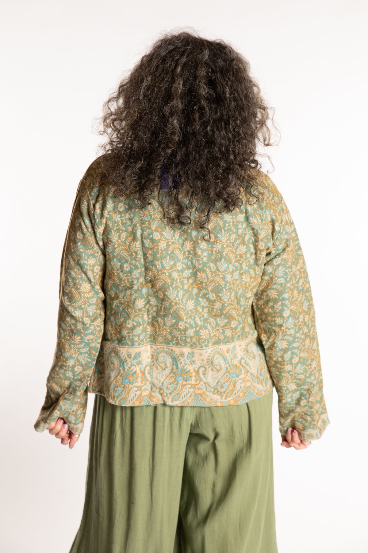 Susan is wearing the M/L Malini Soft Brushed Cardigan in Green