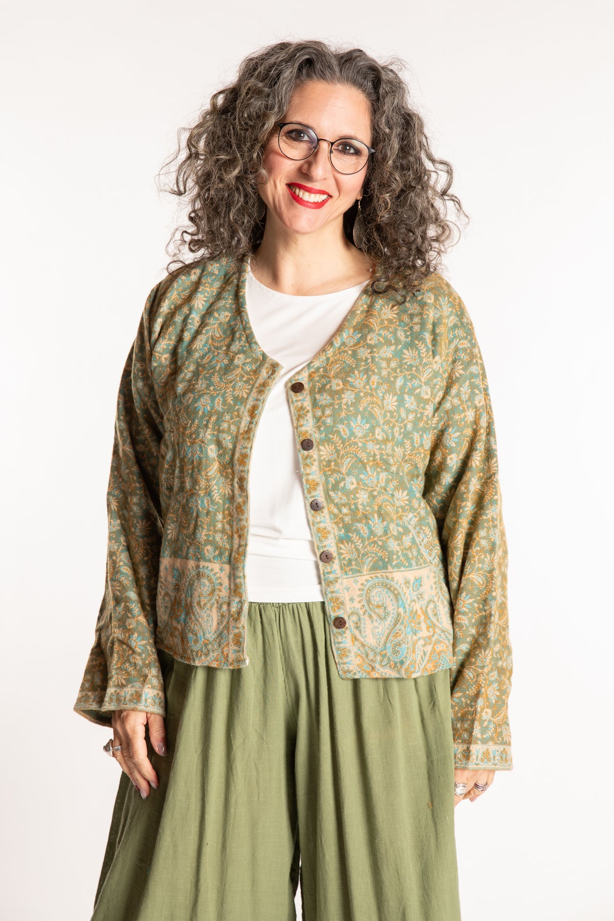 Susan is wearing the M/L Malini Soft Brushed Cardigan in Green