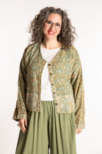 Susan is wearing the M/L Malini Soft Brushed Cardigan in Green