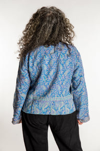 Susan is wearing the M/L Malini Soft Brushed Cardigan in Purple
