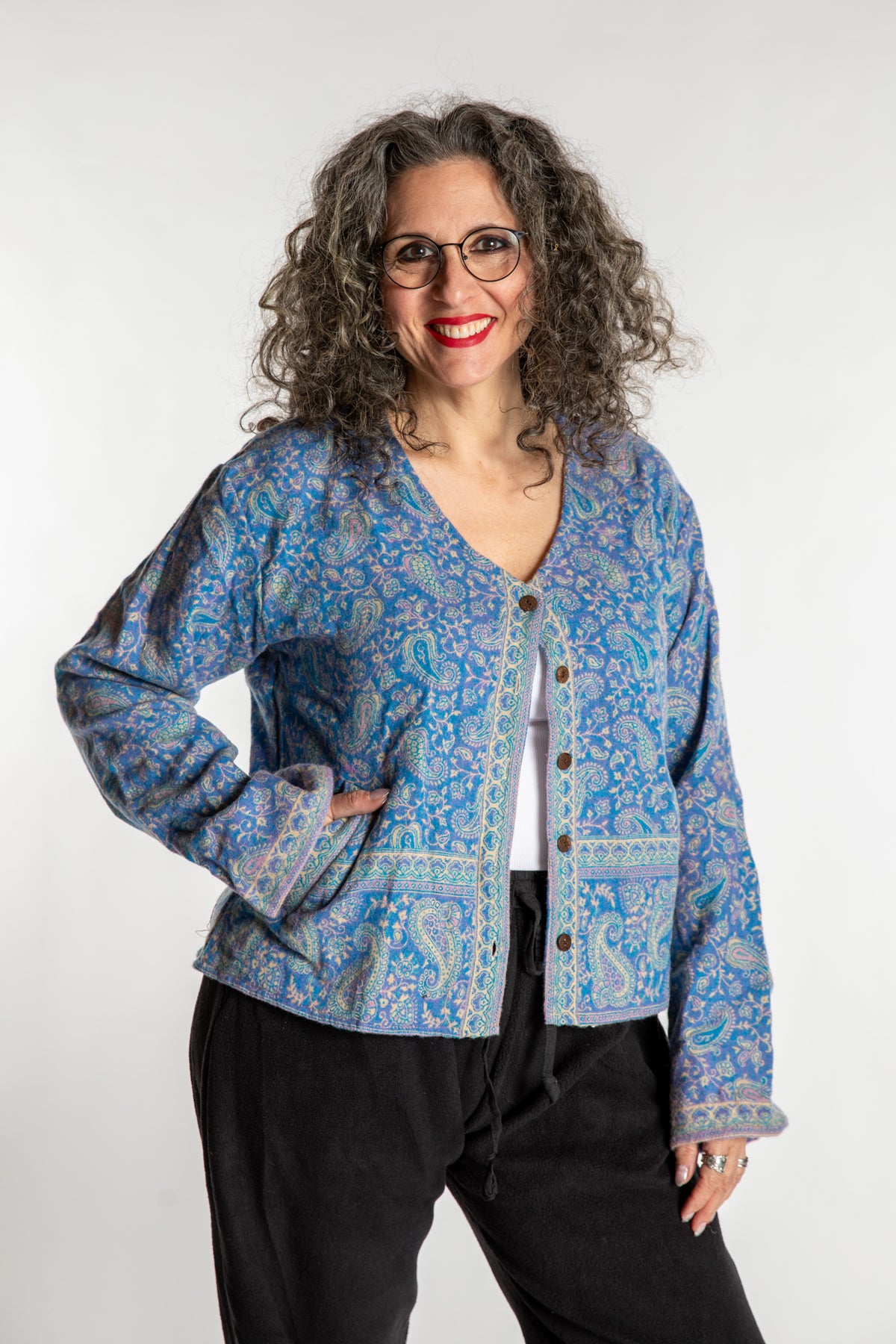 Susan is wearing the M/L Malini Soft Brushed Cardigan in Purple