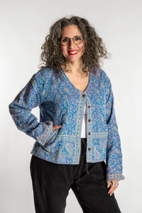 Susan is wearing the M/L Malini Soft Brushed Cardigan in Purple