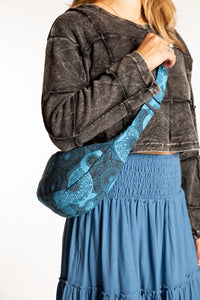 Sophie wearing blue mandala crescent crossbody bag 
