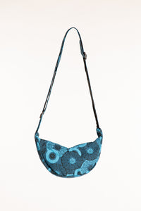 Blue cotton crescent crossbody bag with turquoise mandala patterns and adjustable strap