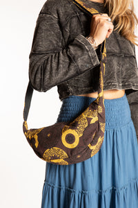 Sophie wearing brown mandala crescent bag with adjustable strap
