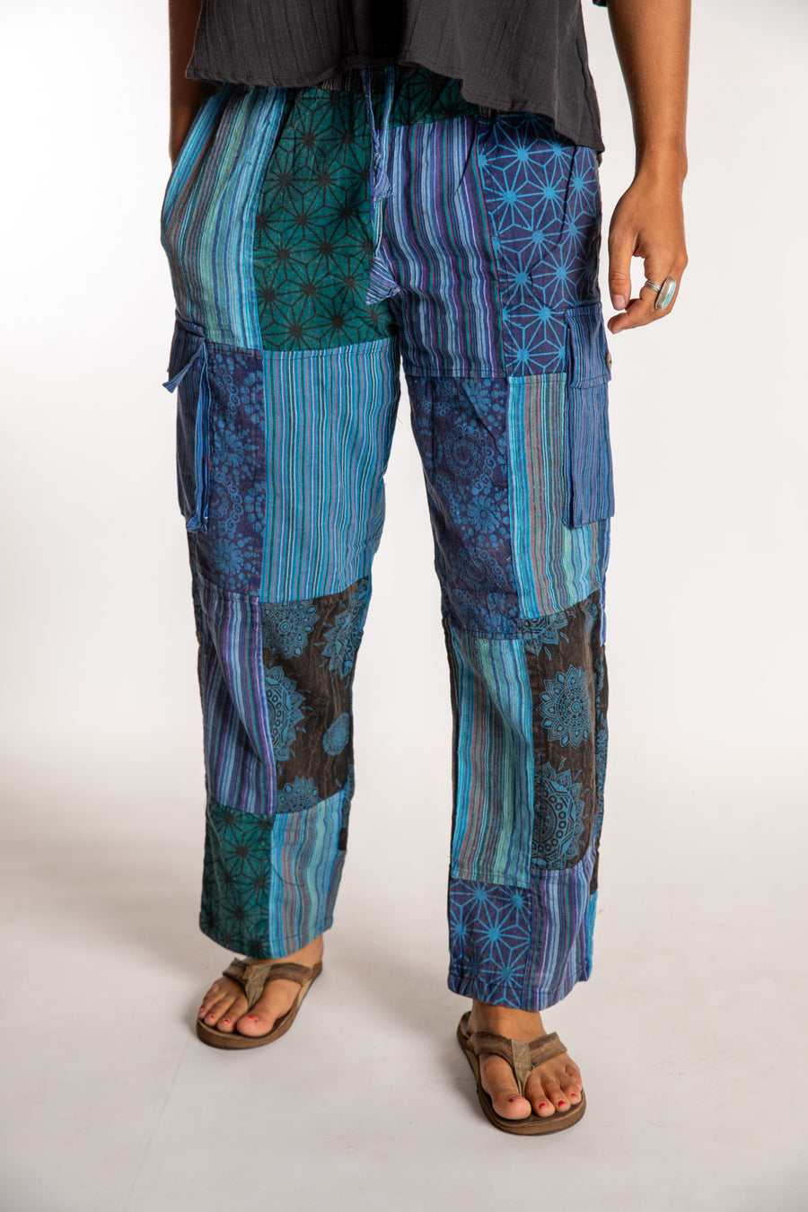 Sophie is wearing the Small Mela Patchwork Cargo Pants in Blue