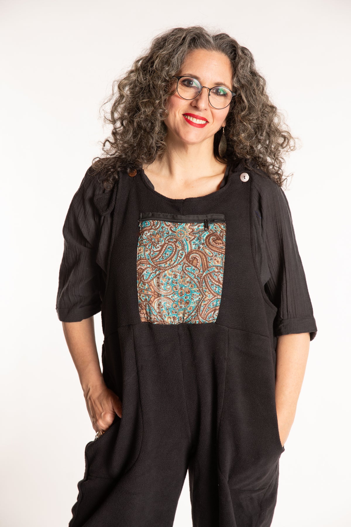 Susan is wearing the M/L Mexicali Fleece Overalls in Black
