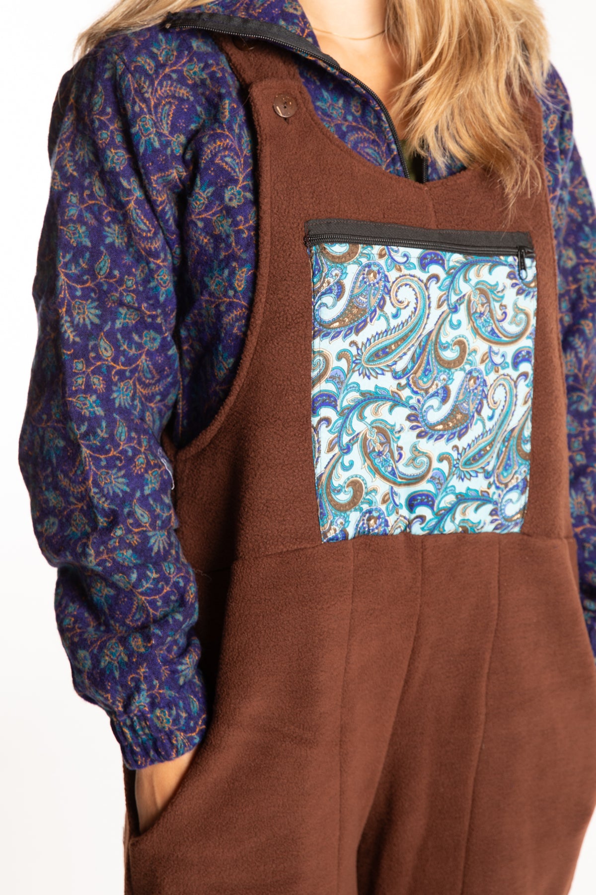Sophie is wearing the S/M Mexicali Fleece Overalls in Brown