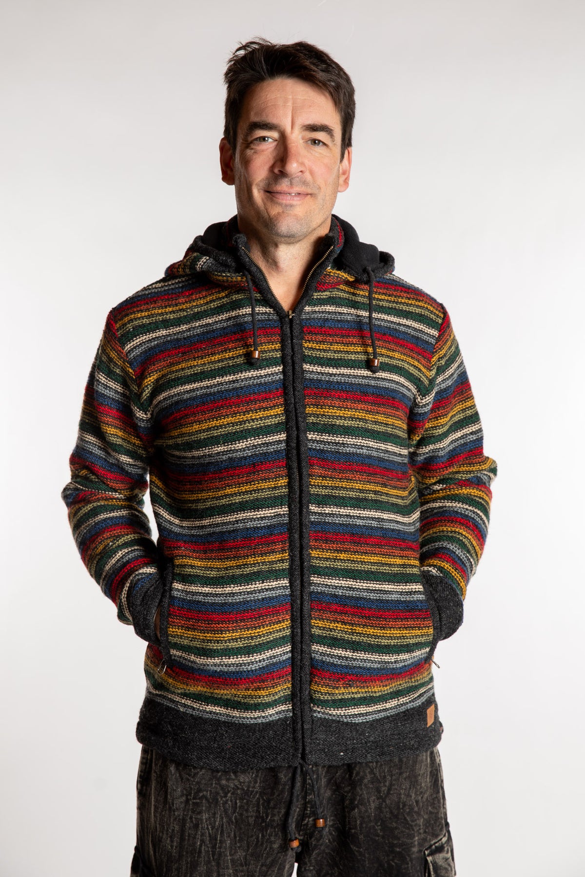 Topher is wearing the Large Mexicali Wool Hoodie Jacket in Multi Stripe