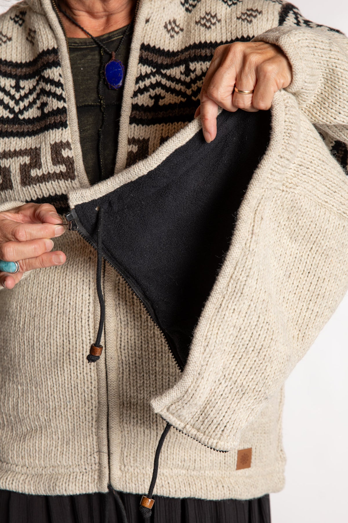 Kim is wearing the Medium Mexicali Patterned Wool Hoodie in Natural