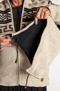 Kim is wearing the Medium Mexicali Patterned Wool Hoodie in Natural
