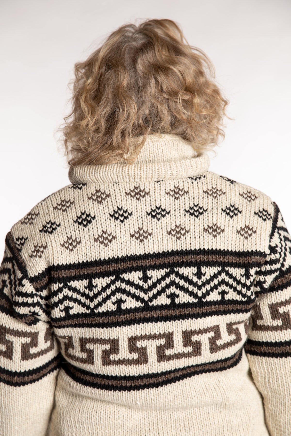 Kim is wearing the Medium Mexicali Patterned Wool Hoodie in Natural
