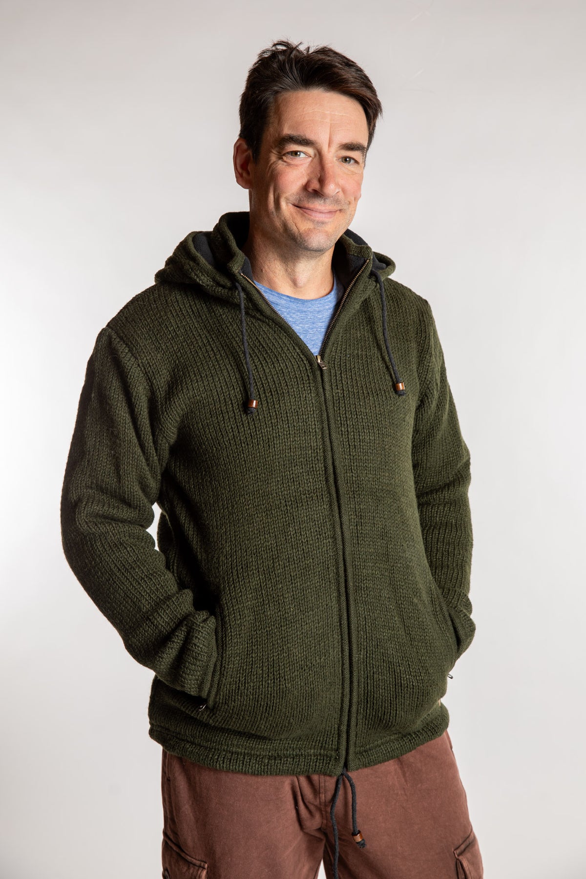 Topher is wearing the Large Mexicali Wool Hoodie Jacket in Olive