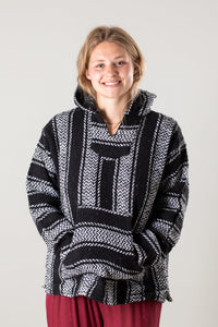 Sophie is wearing size M baja hoodie in Black