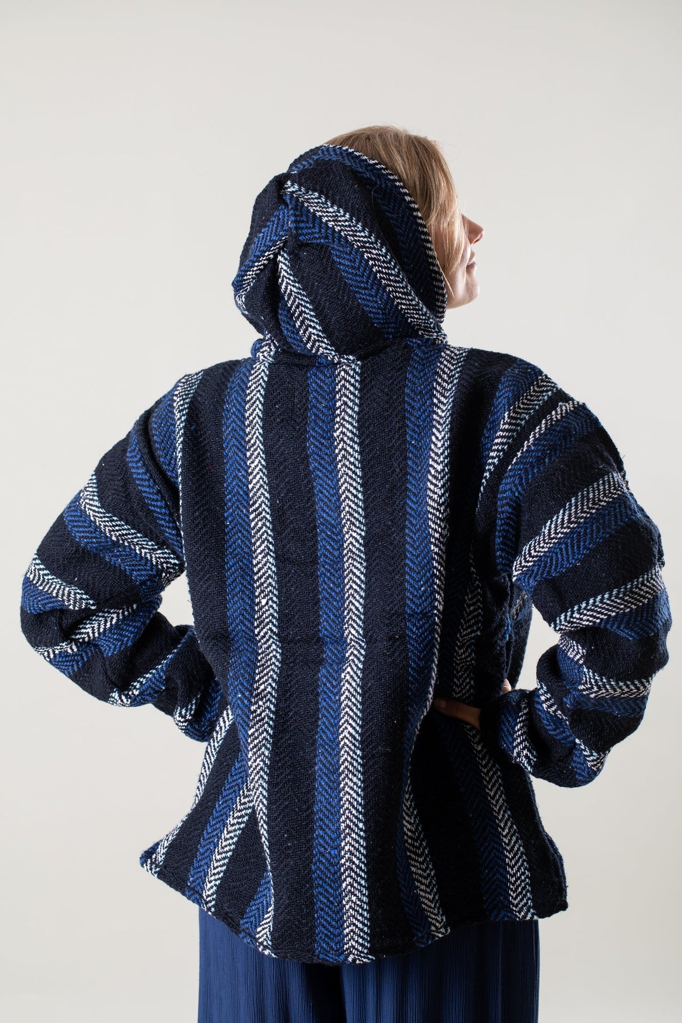 Sophie is wearing a medium Baja Hoodie in Navy