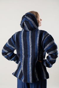 Sophie is wearing a medium Baja Hoodie in Navy