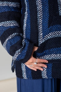 Sophie is wearing size M baja hoodie in navy