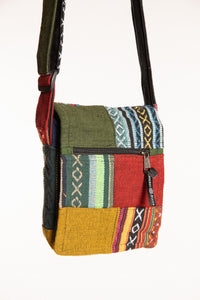 A multicolor mosaic patchwork crossbody bag made from woven textile fabrics