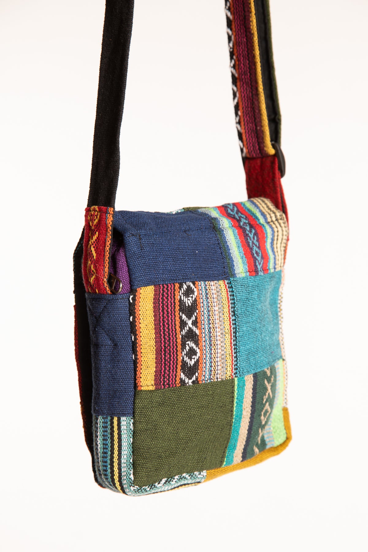 Back view of colorful cotton patchwork crossbody bag showing contrasting fabric panels