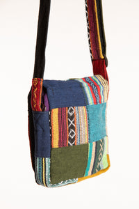 Back view of colorful cotton patchwork crossbody bag showing contrasting fabric panels