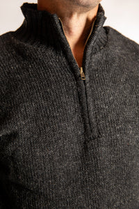 Topher is wearing the Large Nordic Quarter Zip Wool Sweater in Charcoal