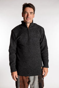 Topher is wearing the Large Nordic Quarter Zip Wool Sweater in Charcoal