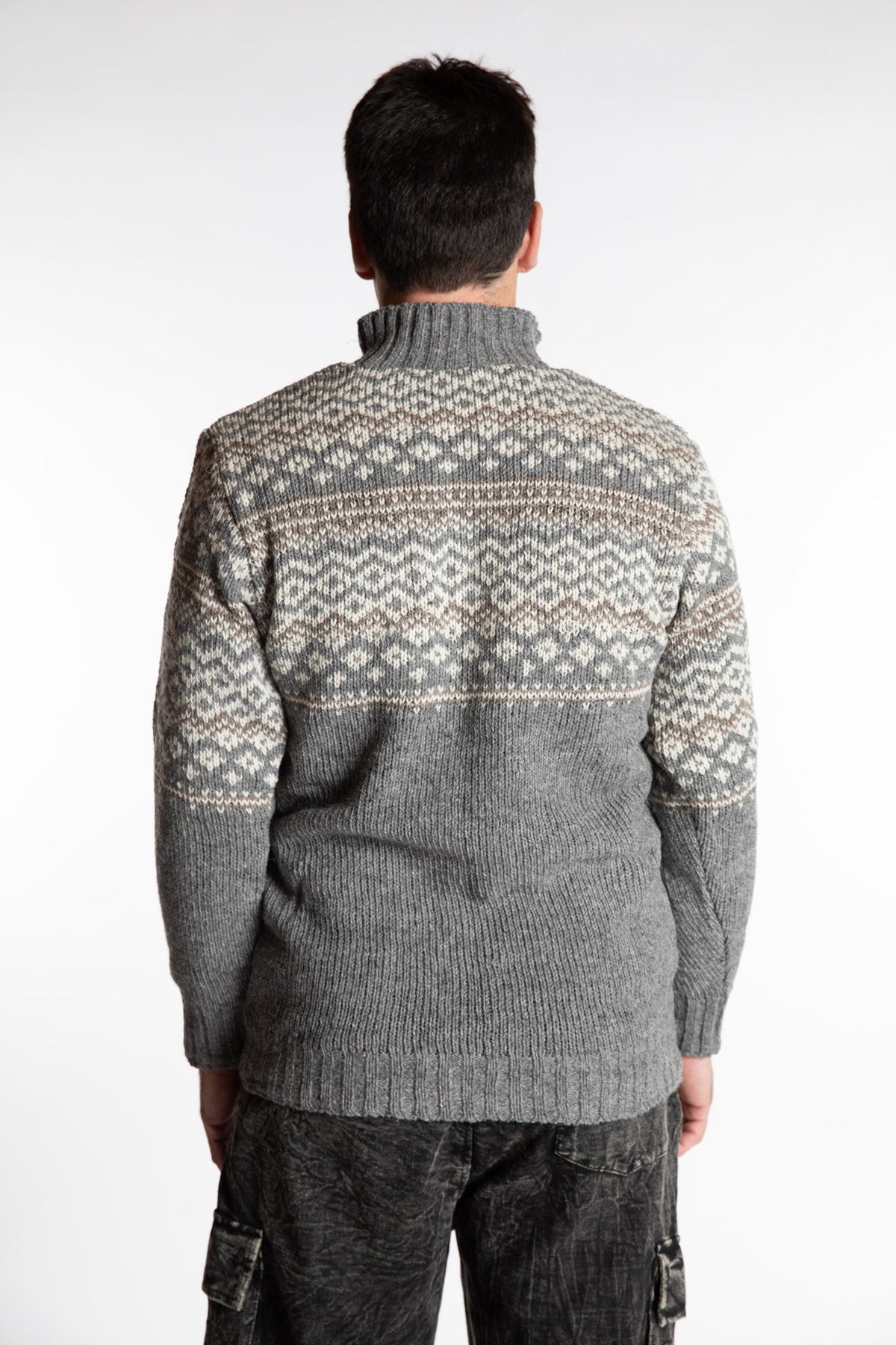 Topher is wearing the Large Nordic Quarter Zip Wool Sweater in Light Gray Pattern