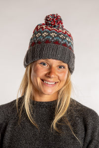 Sophie is wearing the North Country Patterned Wool Pom Bean in Red