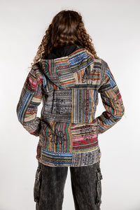 Emily is wearing the Black Pahadi Patchwork Jacket in S/M