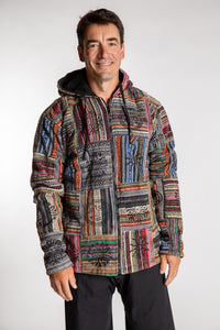 Topher is wearing the Black Pahadi Patchwork Jacket in XXL
