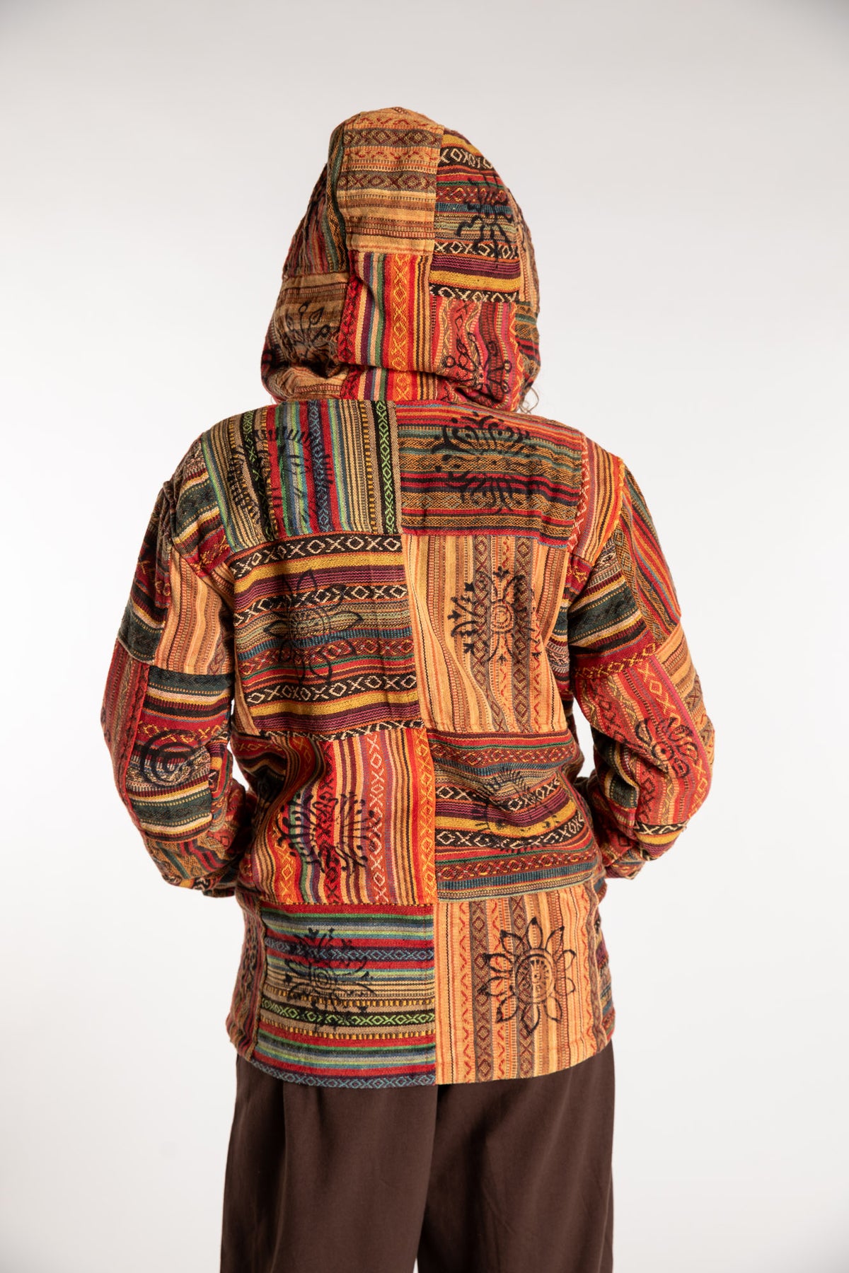 Emily is wearing the Orange Pahadi Patchwork Jacket in S/M