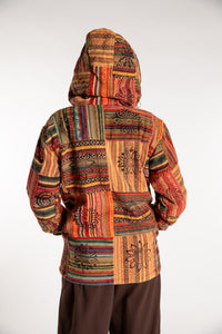Emily is wearing the Orange Pahadi Patchwork Jacket in S/M