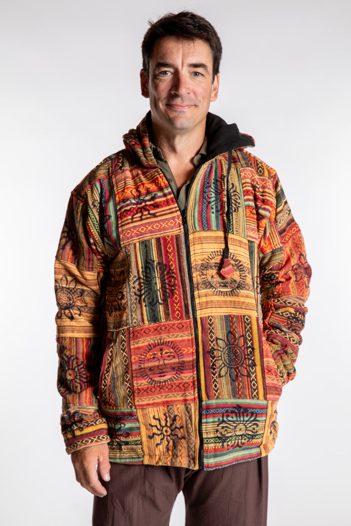 Topher is wearing the Orange Pahadi Patchwork Jacket in XXL
