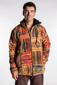 Topher is wearing the Orange Pahadi Patchwork Jacket in XXL