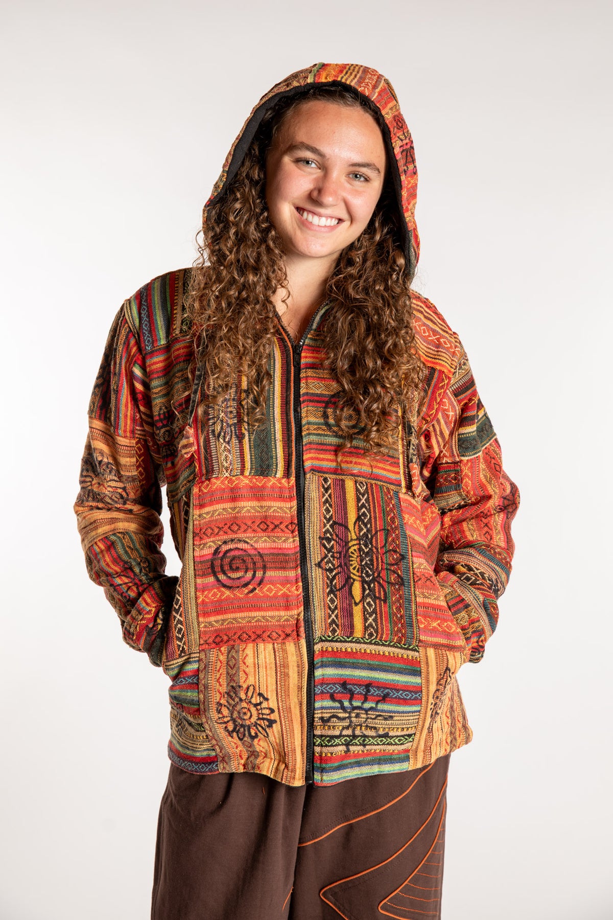 Emily is wearing the Orange Pahadi Patchwork Jacket in S/M