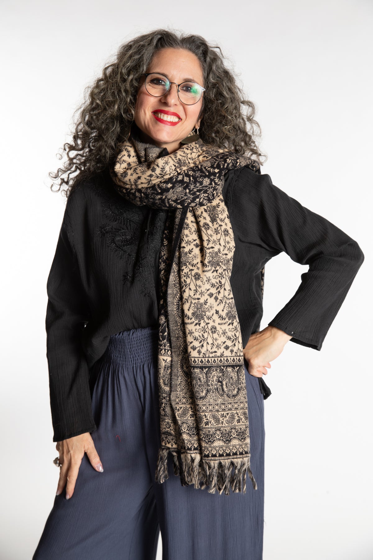 Susan is wearing the Paisley Soft Brushed Shawl in Black
