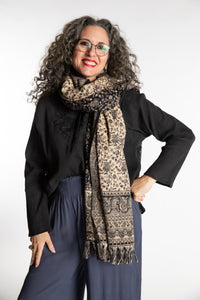 Susan is wearing the Paisley Soft Brushed Shawl in Black