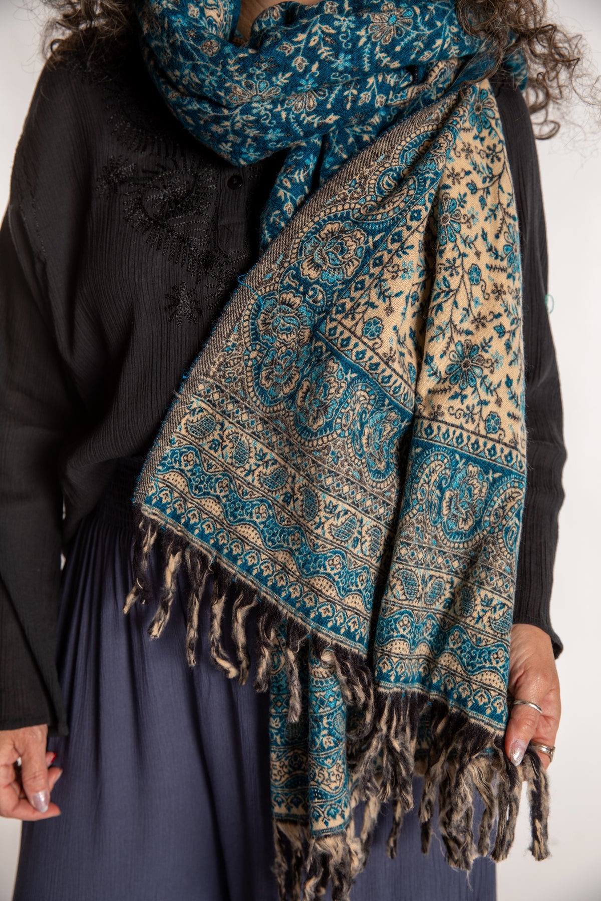 Susan is wearing the Paisley Soft Brushed Shawl in Blue