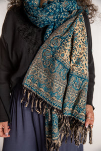Susan is wearing the Paisley Soft Brushed Shawl in Blue