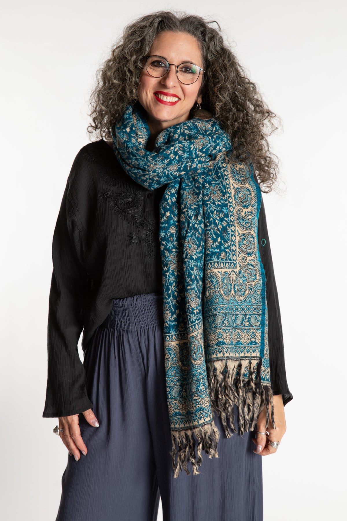 Susan is wearing the Paisley Soft Brushed Shawl in Blue