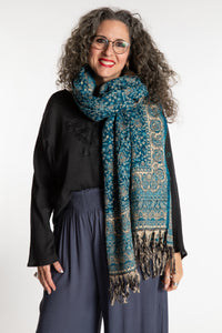 Susan is wearing the Paisley Soft Brushed Shawl in Blue