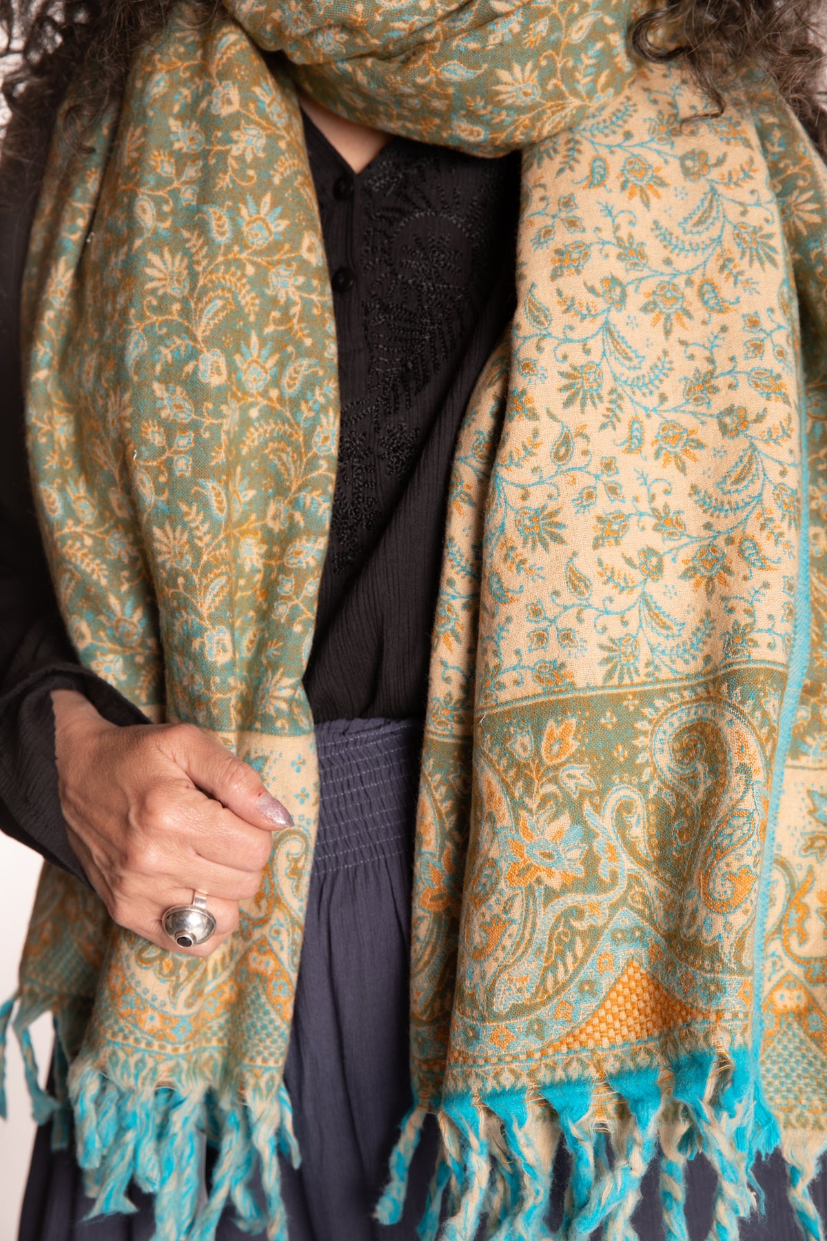 Susan is wearing the Paisley Soft Brushed Shawl in Green